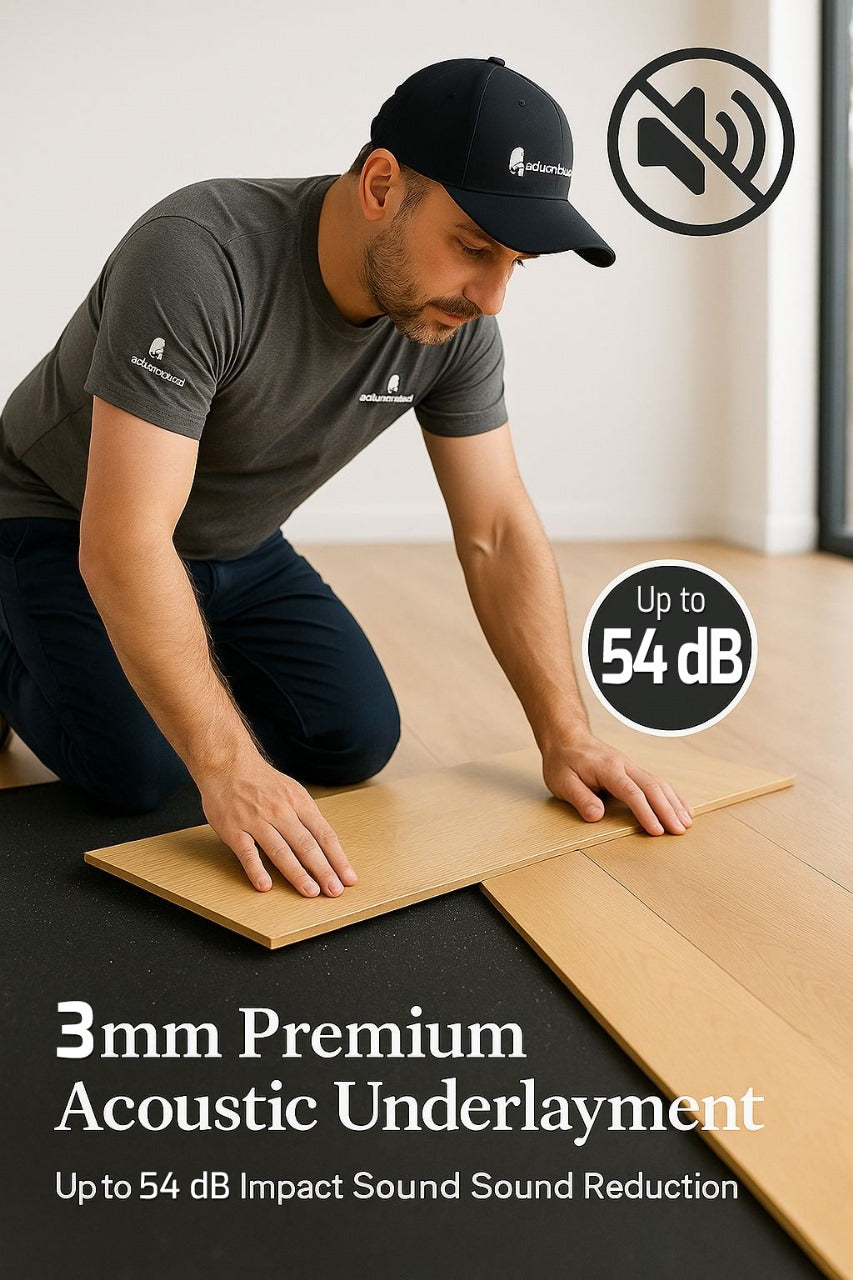 Man kneeling while fitting a wooden plank over 3mm Acoustic Soundproof Underlay Linear Metre – Rubber Sheet for Flooring & Impact Noise Insulation. Promotes up to 54 Silentcloud noise reduction, ideal for soundproofing and acoustic insulation.