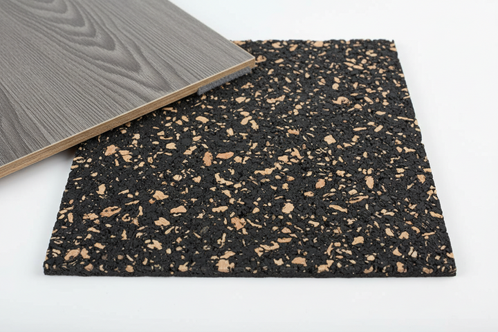 SilentCloud Acoustic Cork Rubber Underlay sample with gray wood-grain laminate plank atop. Premium soundproofing, noise reduction, and sound insulation for various floors. Ideal for residential and commercial use, available in 3mm and 4.5mm thicknesses.