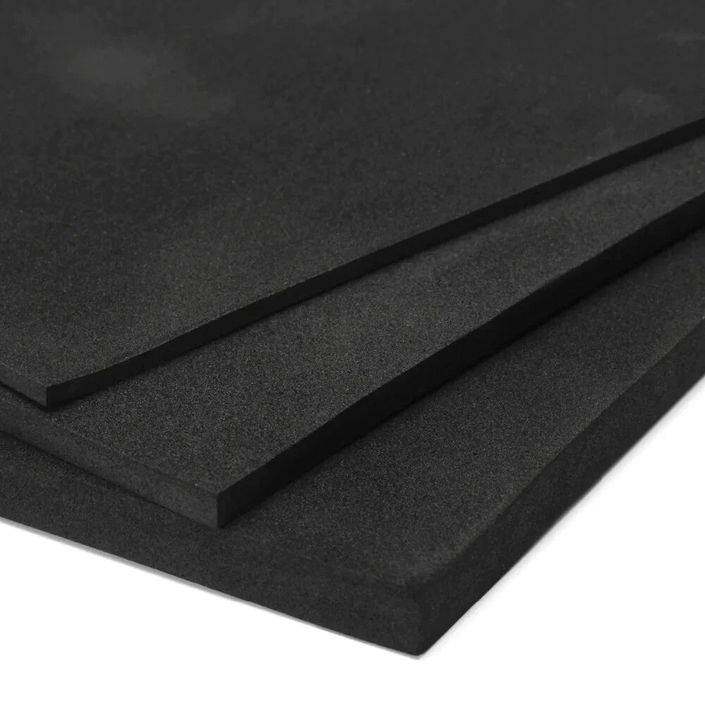 Three stacked sheets of 12mm Acoustic Insulation Foam Sheet Dark Grey Class O, featuring self-adhesive backing for easy installation. Ideal for noise reduction, soundproofing, and vibration damping in various applications.