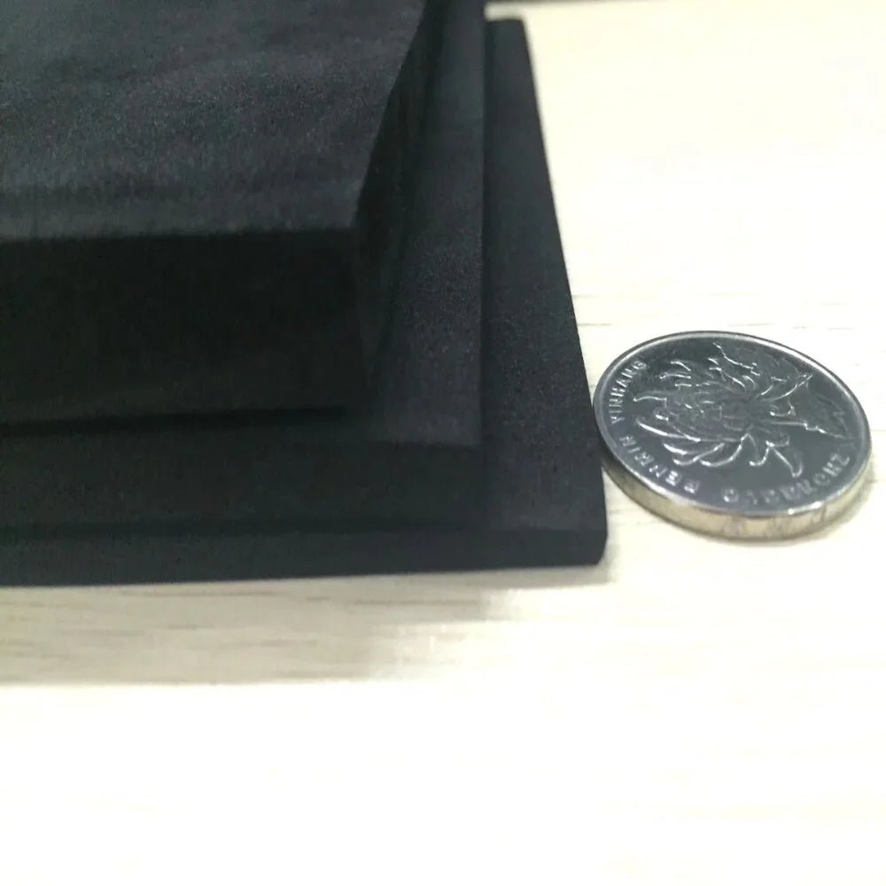 12mm Acoustic Insulation Foam Sheet Dark Grey Class O, shown with a Malaysian coin for scale, demonstrating its thin, rectangular form. Ideal for soundproofing, noise reduction, and vibration damping applications.